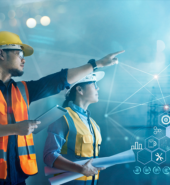 Construction workers analyzing digital blueprint